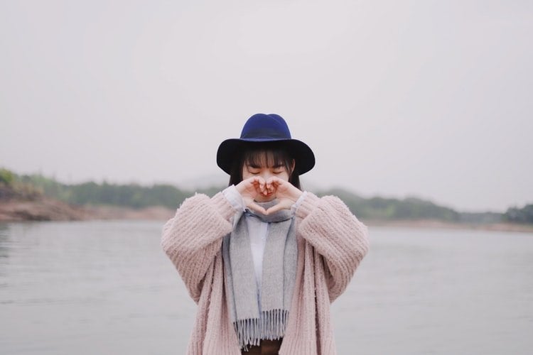 chinese girl with heart hands