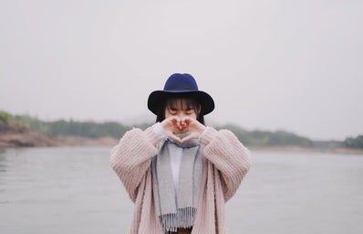 chinese girl with heart hands