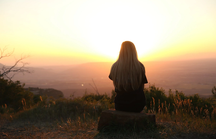 girl sitting in sunset