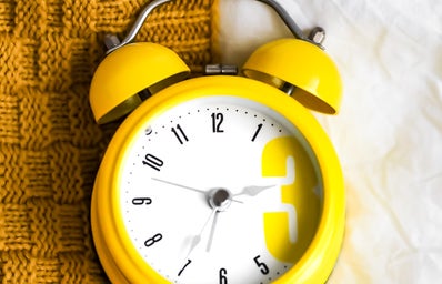 yellow and white alarm clock at 10:10