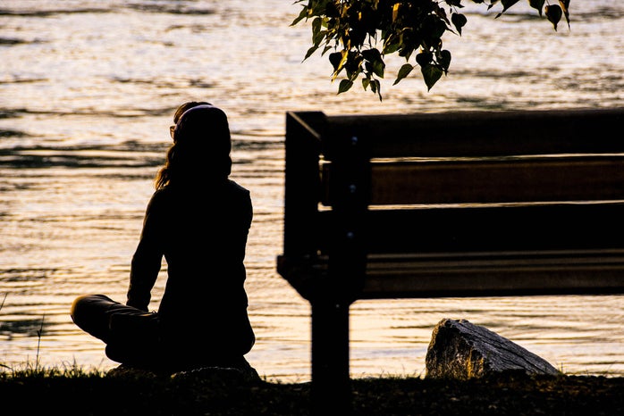 Woman sitting by the river at sunset by Unsplash?width=698&height=466&fit=crop&auto=webp