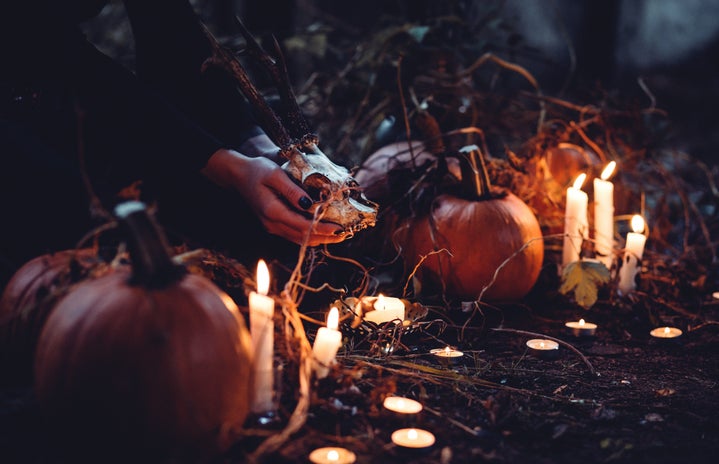 pumpkins, candles, and skull