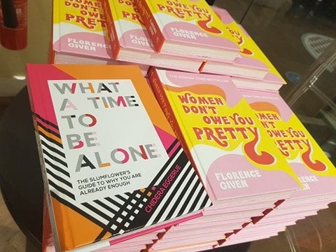 The Slumflower\'s book: What a Time to Be Alone amongst a display of Florence Given\'s book: Women Don\'t Owe You Pretty in Waterstones