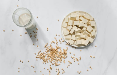 Tofu, chickpeas, and soy milk on a table