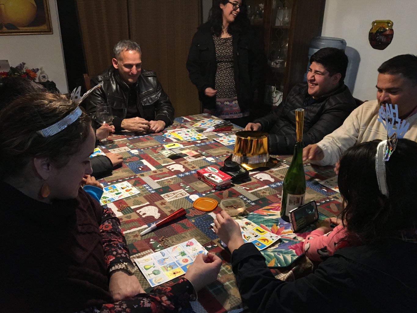 family playing loteria, a Mexican bingo game