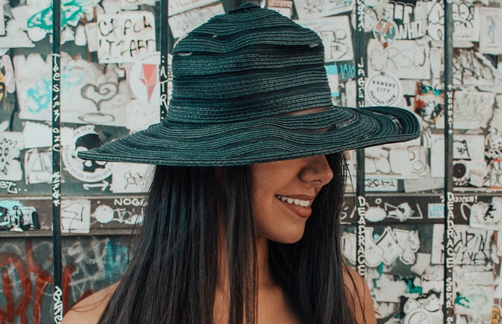 Woman wearing black hat