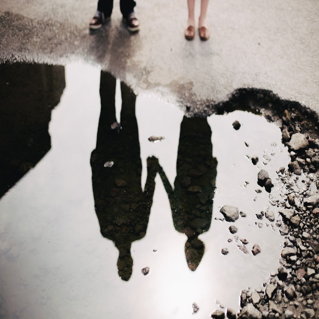 A couple looking at their reflection in water