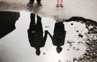 A couple looking at their reflection in water
