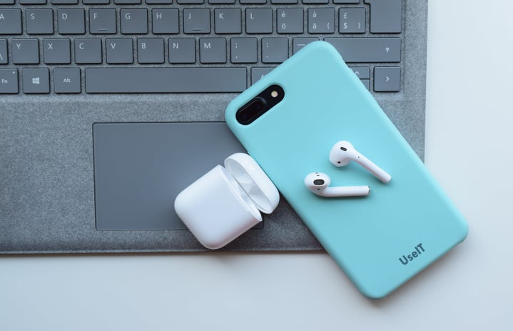 airpods and phone on laptop by Behar Zenuni?width=719&height=464&fit=crop&auto=webp
