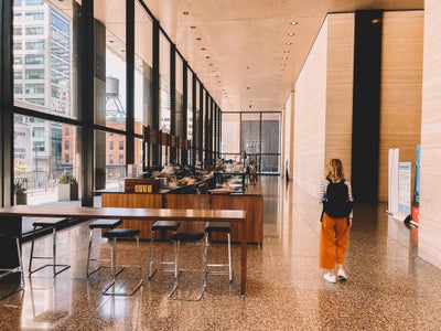 girl walking in modern sleek coffee shop