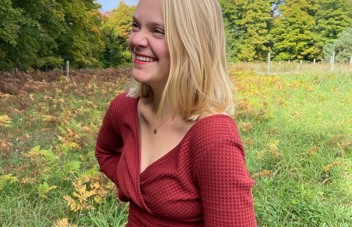 taylor manley, girl in a field, fall, trees, blonde girl, red shirt