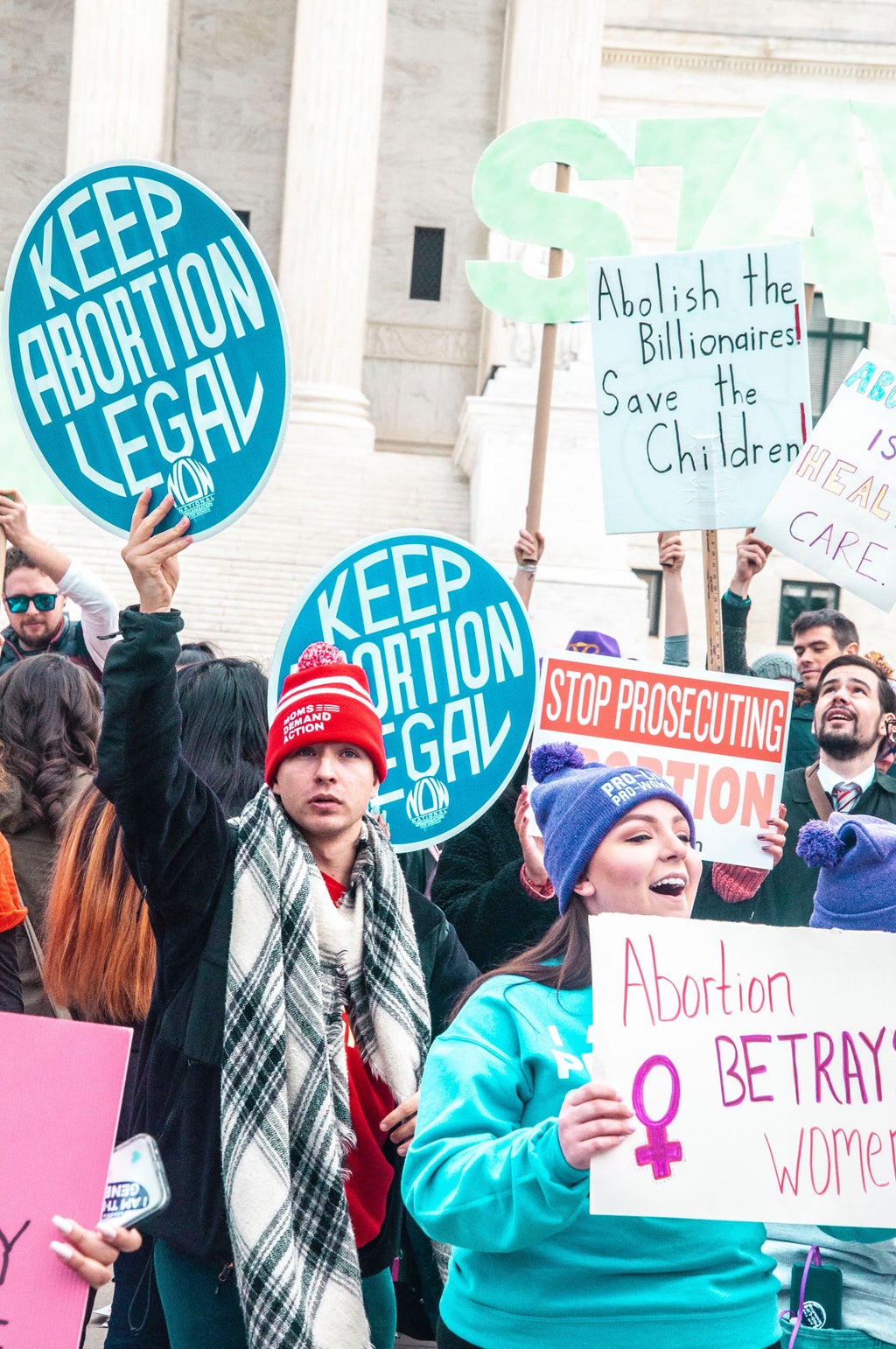 People holding signs at a pro-choice rally in Washington D.C