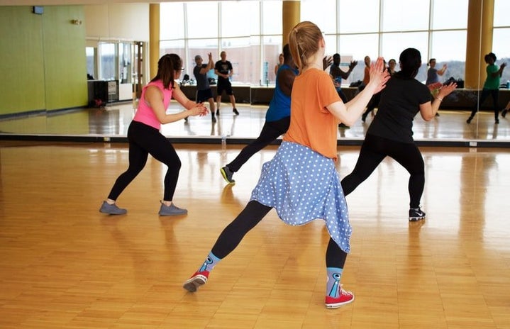 women dancing in a mirror