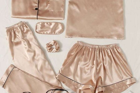 Light pink and black satin pajama set. Short and long style.