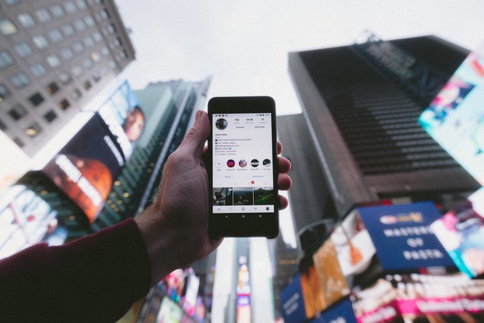 cell phone in front of city buildings by Jakob Owens on Unsplash?width=698&height=466&fit=crop&auto=webp