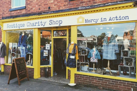 Front of a charity shop- Mercy in Action boutique