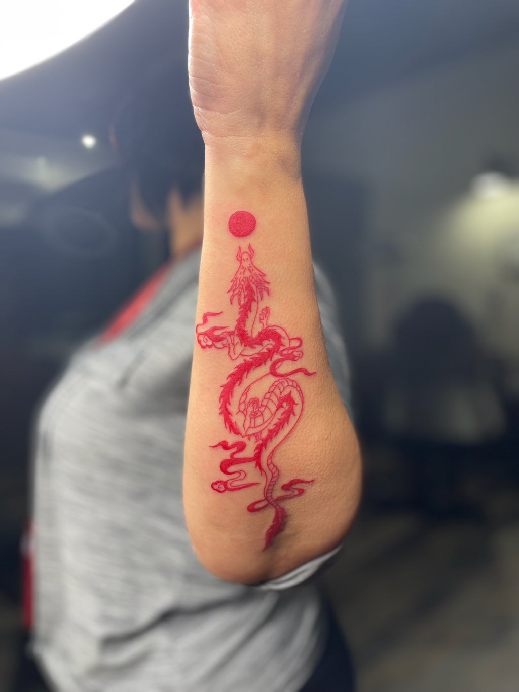 Talia\'s red dragon tattoo