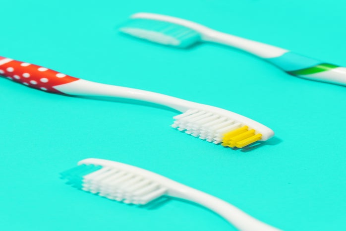 3 toothbrushes on blue background by amirhosein esmaeili from Unsplash?width=698&height=466&fit=crop&auto=webp