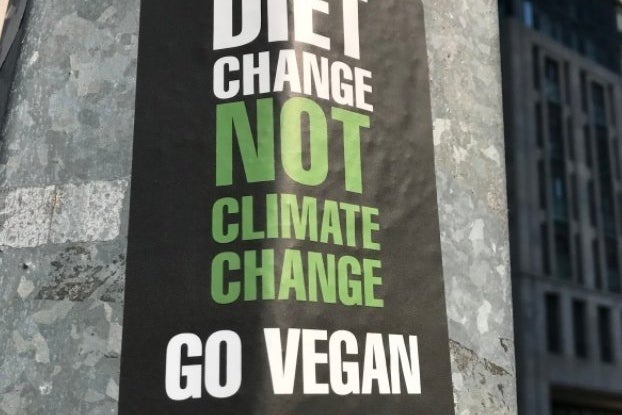 Diet Change not climate change go vegan sign by Levi Hearne?width=698&height=466&fit=crop&auto=webp