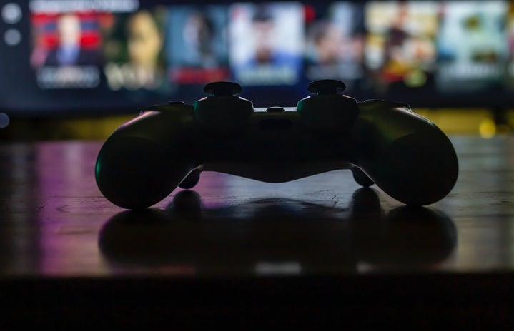 gaming controller on table by Designnnco on Unsplash?width=719&height=464&fit=crop&auto=webp