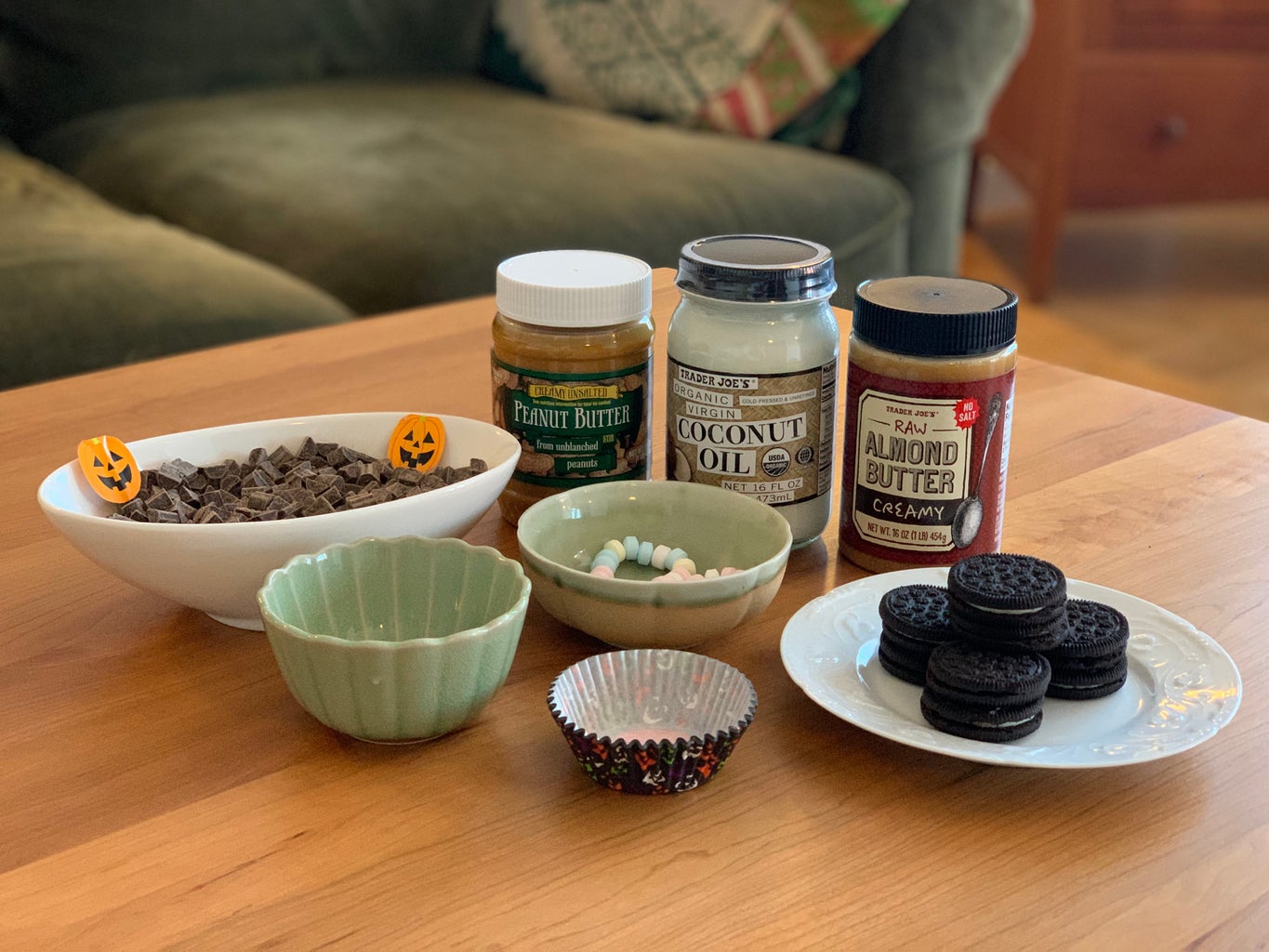 Ingredients such as chocolate, peanut butter and cookies are arranged on table.