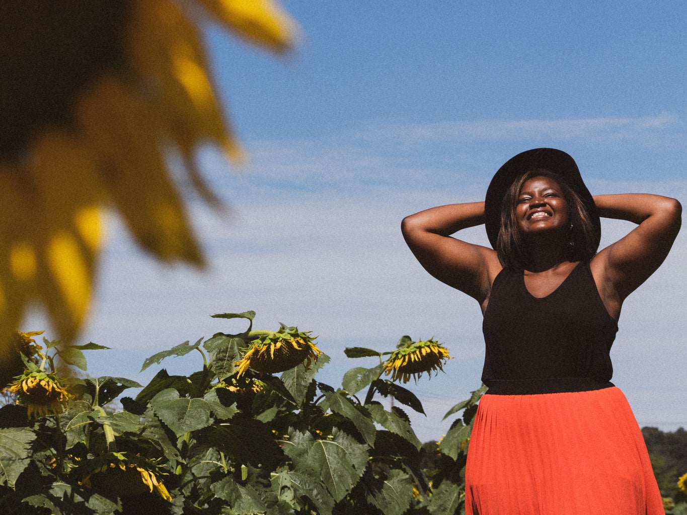 Woman smiling in sunflower field