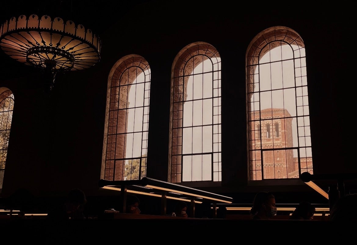 The inside of Powell Library at UCLA, mostly emphasizing the windows and light fixture