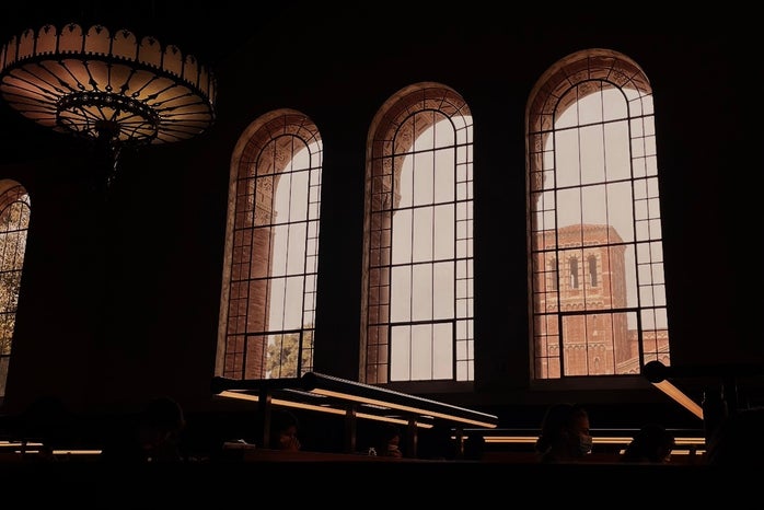 The inside of Powell Library at UCLA, mostly emphasizing the windows and light fixture