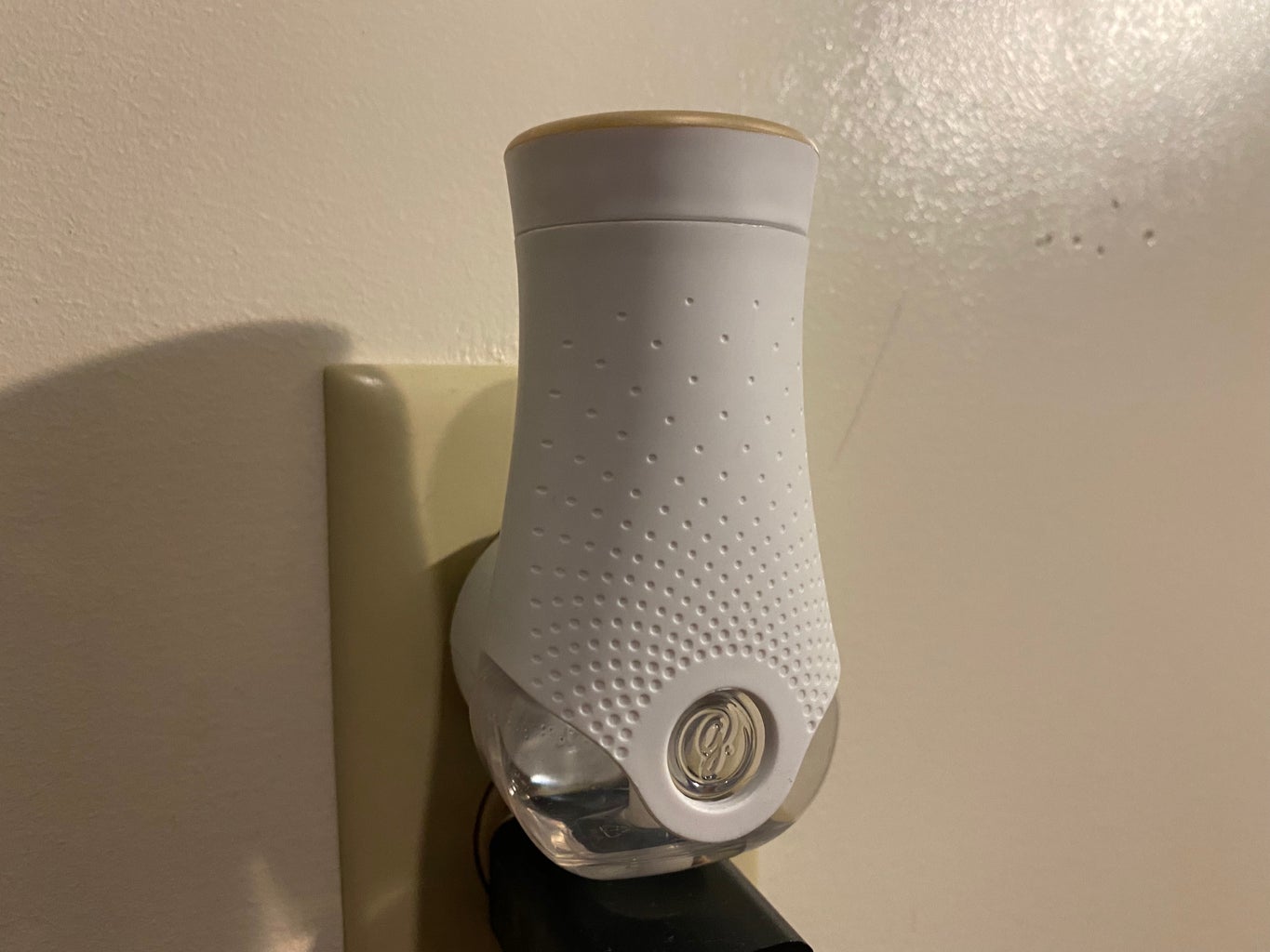 Glade air freshener plugged into the wall