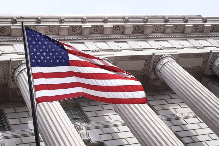 us flag in front of government buildingjpg by Brandon Mowinkle?width=698&height=466&fit=crop&auto=webp