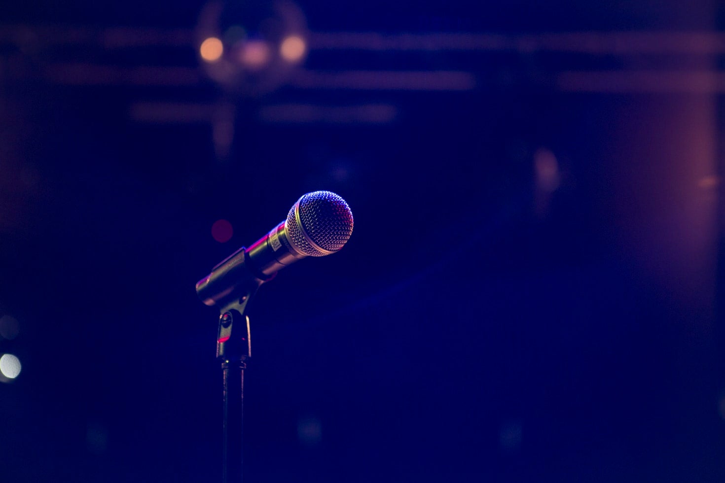 microphone with dark blue lighting in background