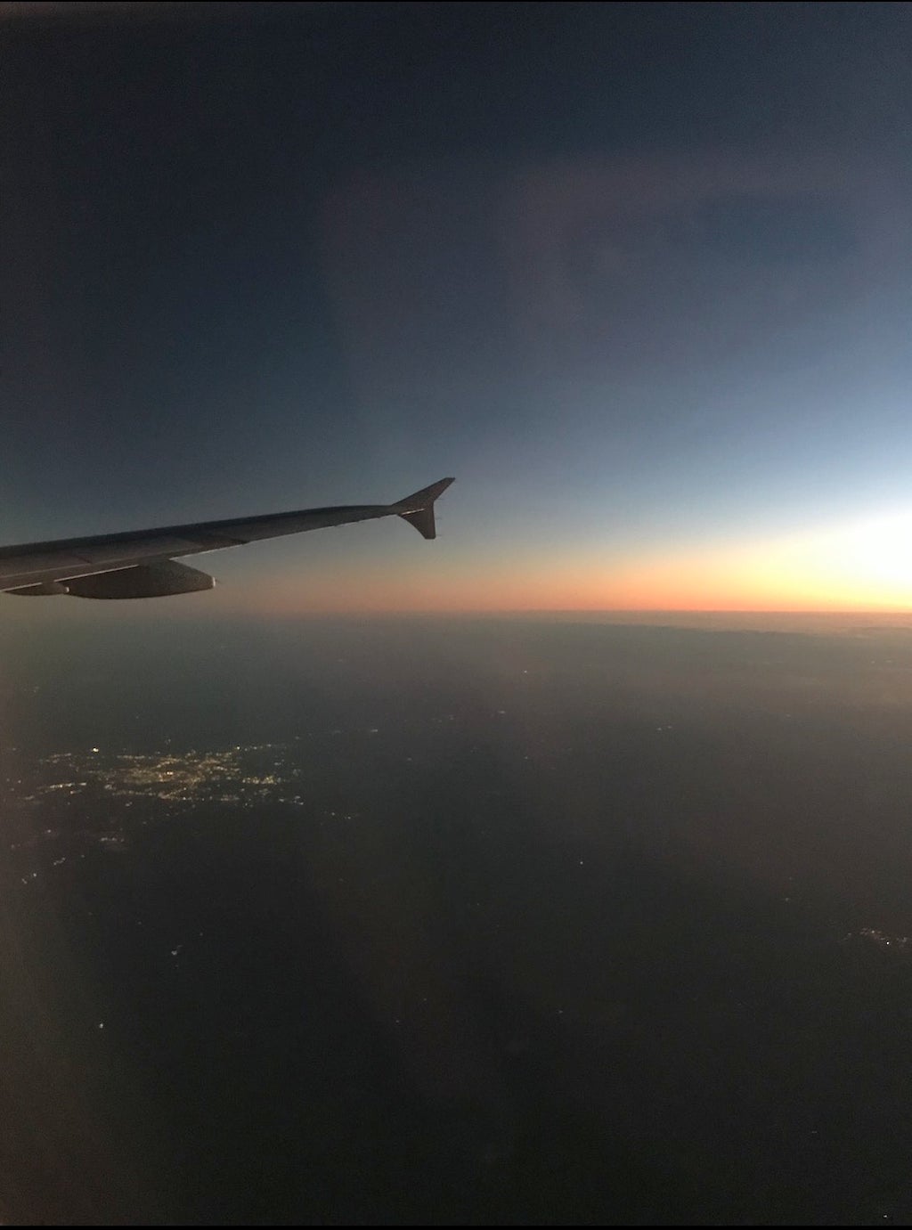 plane flying during sunset