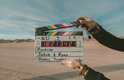 person holding clapperboard