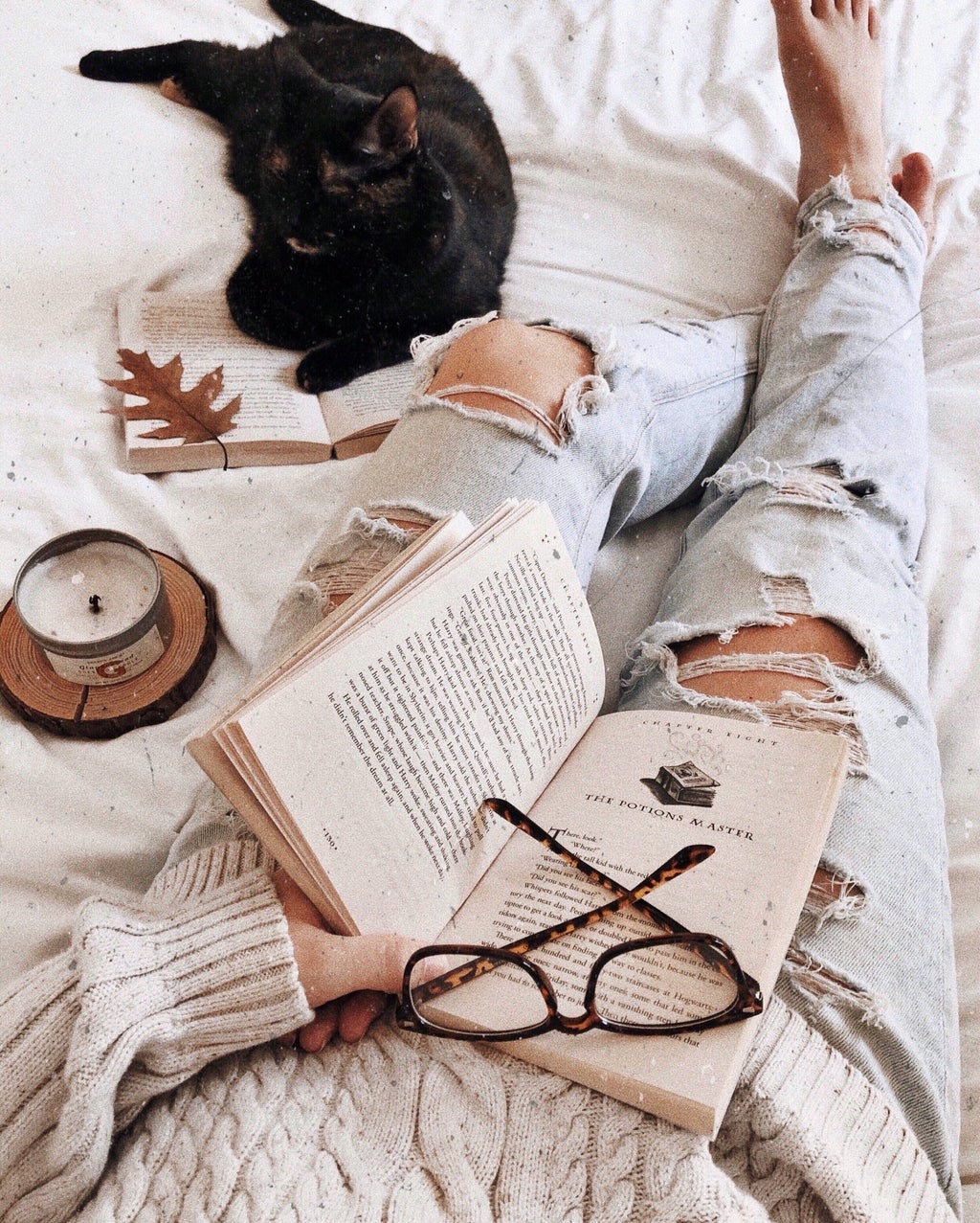 Book, candle, and glasses