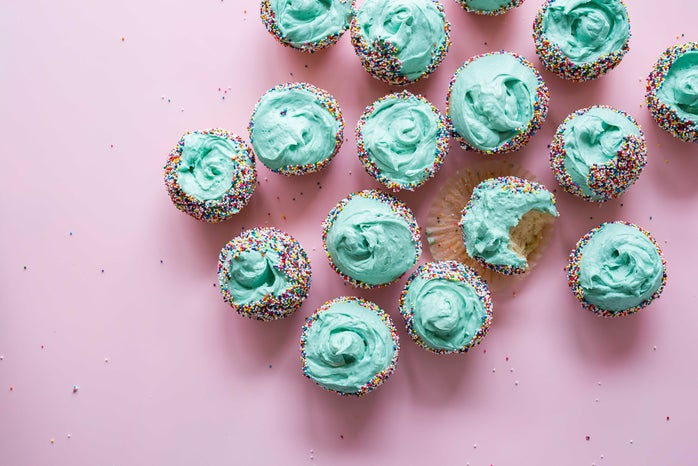 dozen cupcakes with teal icing