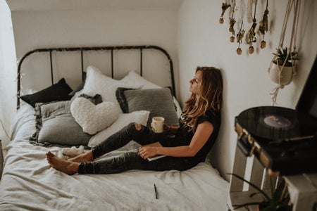 Women siting on her bed