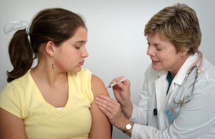 doctor giving girl vaccination by Unsplash?width=719&height=464&fit=crop&auto=webp