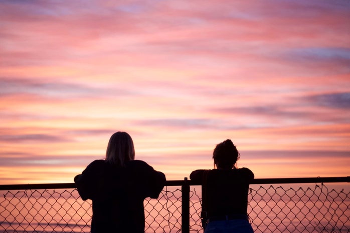 Silhouette of two people at sunset by Tori Wise?width=698&height=466&fit=crop&auto=webp