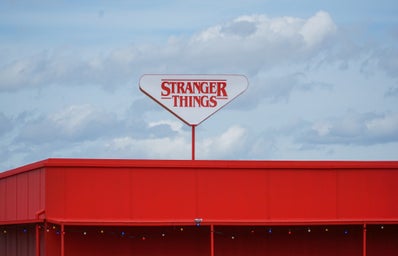 A building sign that reads \"Stranger Things.\"