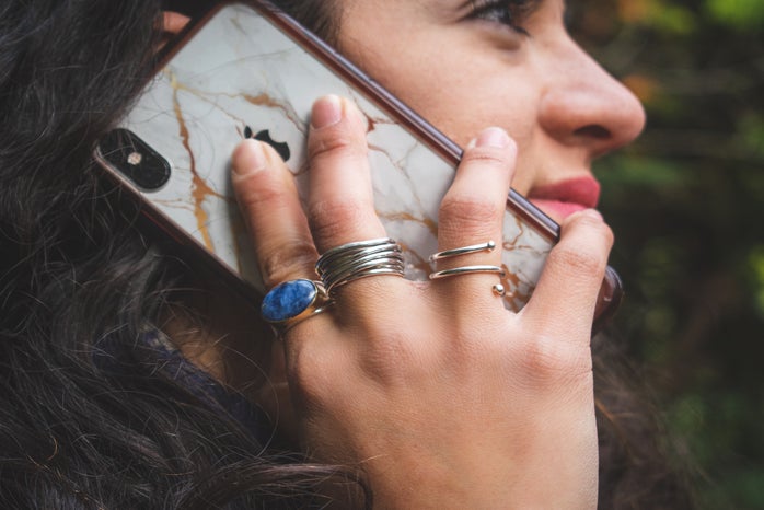 Woman holding an iPhone to her ear by Patricia Zavala?width=698&height=466&fit=crop&auto=webp
