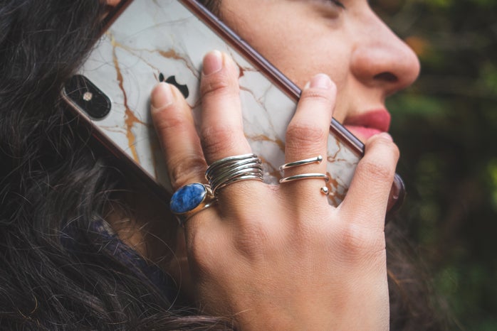 Woman holding an iPhone to her ear by Patricia Zavala?width=698&height=466&fit=crop&auto=webp
