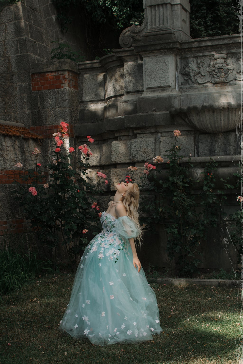 woman dressed like a princess in a garden