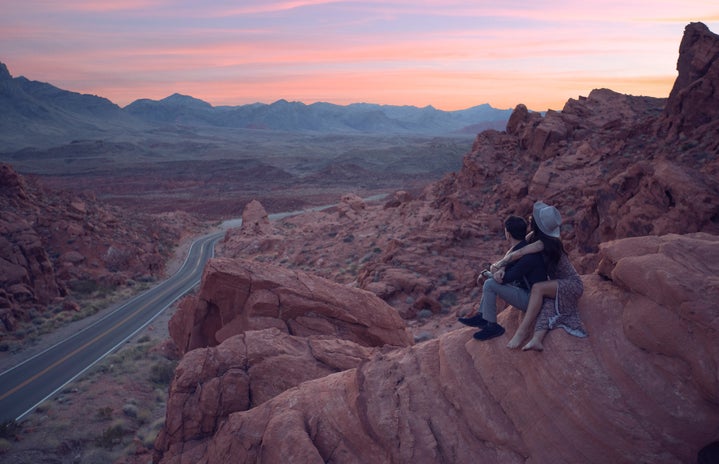 A couple at the top of a mountain in the Valley of Fire in the US