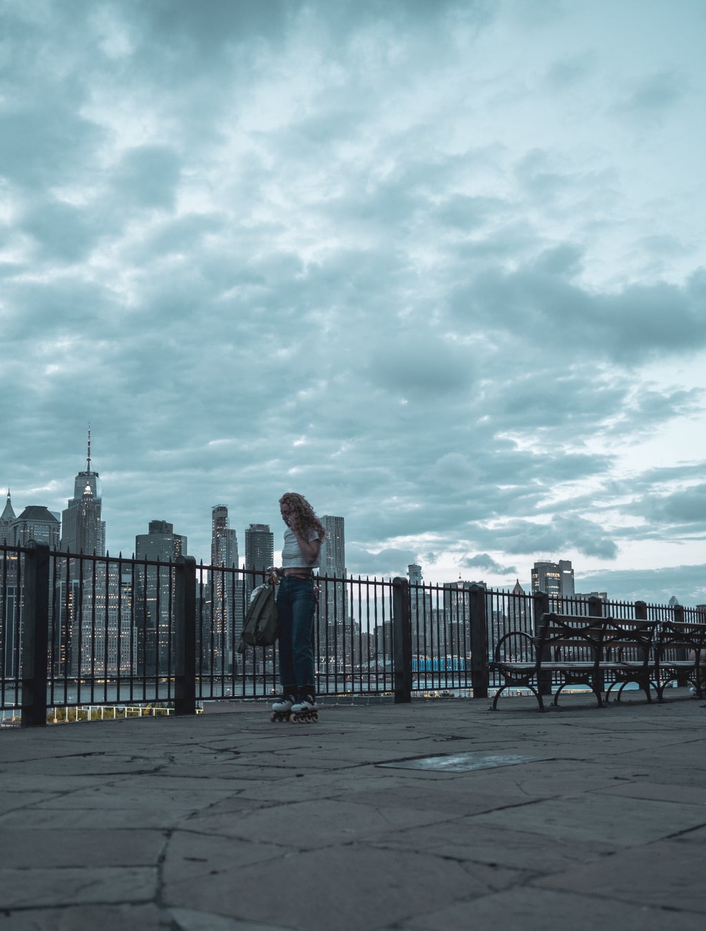Person standing in front of NYC skyline