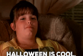 a girl in a chair saying halloween is cool