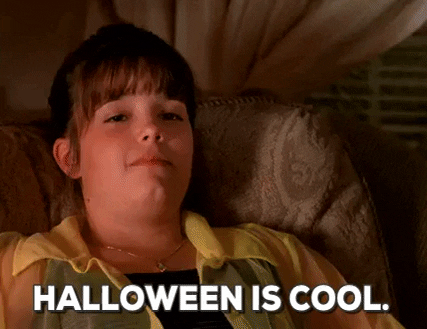 a girl in a chair saying halloween is cool