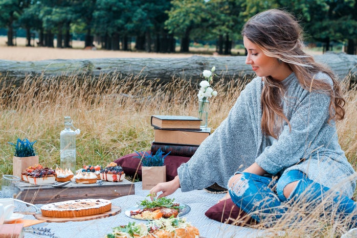 woman sitting on blanket having a picnic by Toa Heftiba Unsplash?width=698&height=466&fit=crop&auto=webp