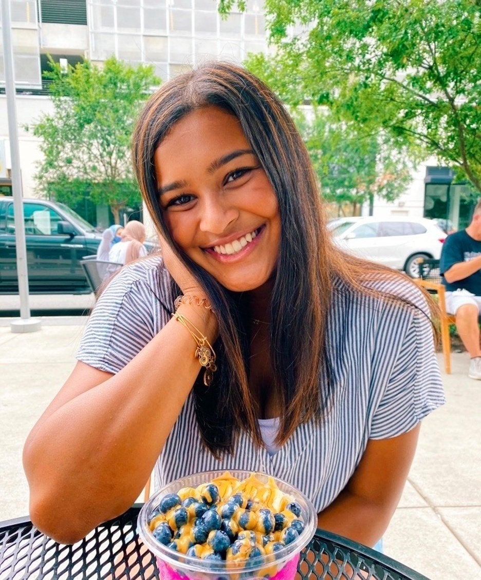 girl smiling at a table
