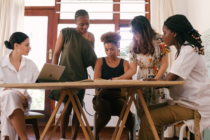 Women gather around a table