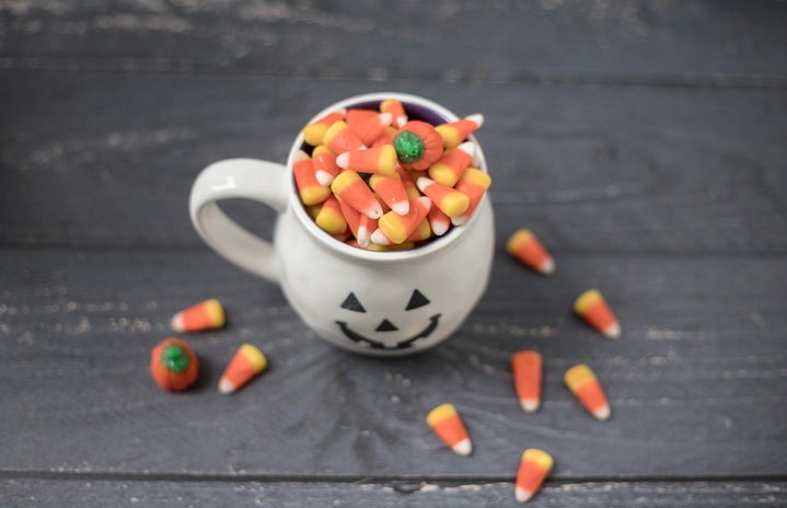 Halloween jack-o-lantern mug filled with candy corn